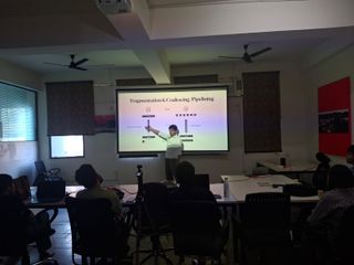 Speaker explaining TCP packet pipelining on a projector